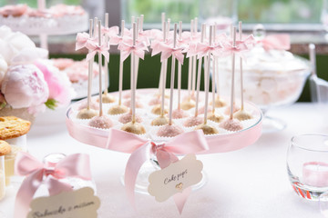 Stylish cake pops on a wedding sweet table