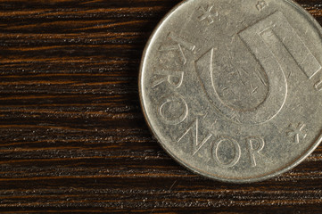 Swedish coin on a wooden background. krone from Sweden close up