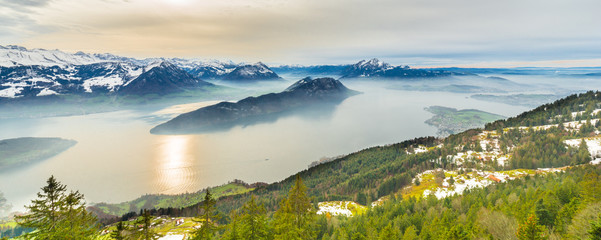 Fototapeta premium Top of the mountains view of the Swiss Alps Mountains and Lake Lucerne.