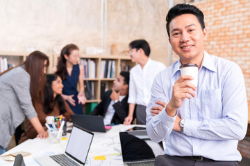 young smart asian entrepreneur startup company portrait smileing with successful and confident in brainstorm meeting office background