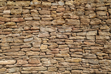 Old castle stone wall texture background. Part. Sand color, natural stone. Design.