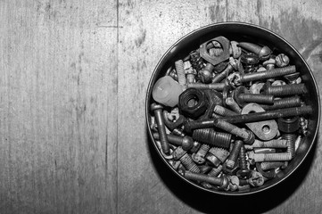 Old screws in a box. pile of fasteners in the box close up. a lot of various screws. carpentry workshop. working tool