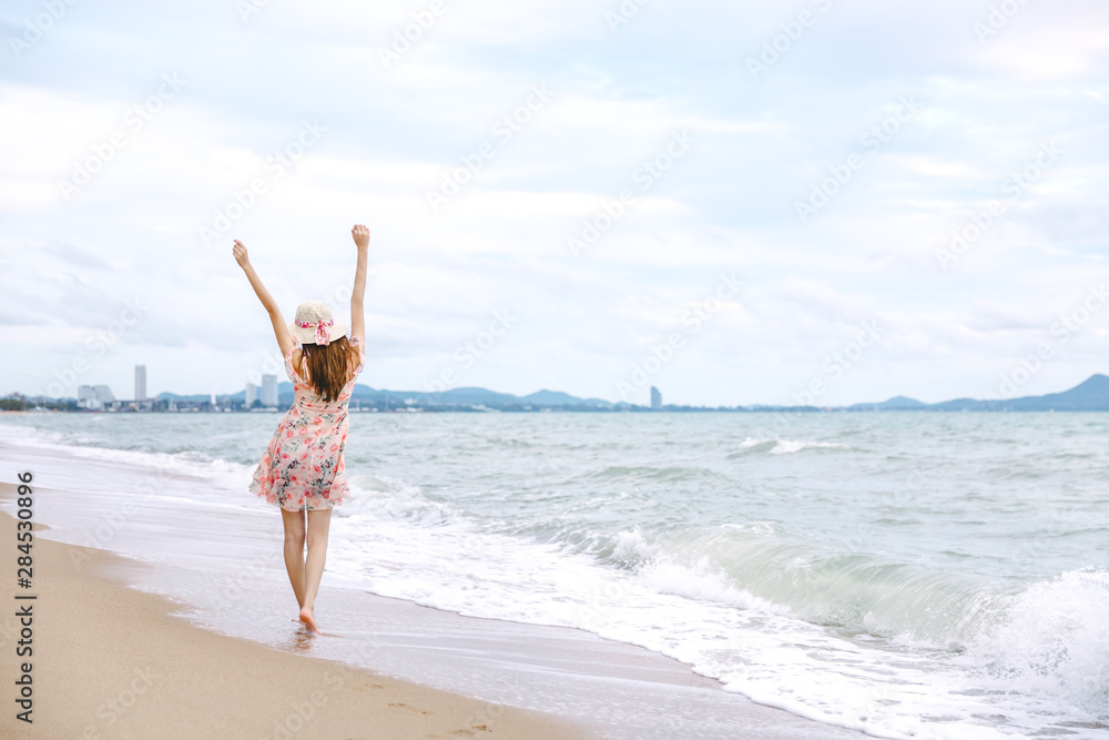 Sticker travel woman walking on beach