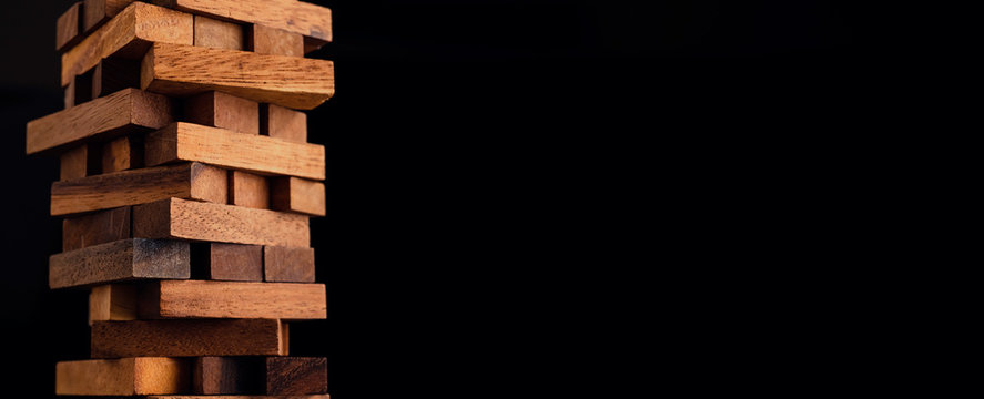 business organize  management strategy ideas concept wood stack block tower arranging with dark background