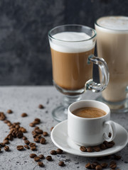 Different types of coffee on the table in a mug and glass