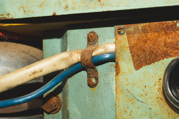 Old wires attached to an apparatus. detail of industrial machine