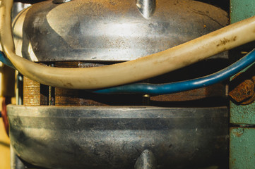Old wires attached to an apparatus. detail of industrial machine