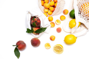 Peaches and apricots in eco bag with copy space.Zero waste concept.Zero waste concept.