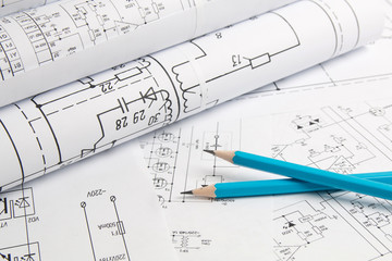 Electronics and Engineering. Pencil on printed drawings of electrical circuits