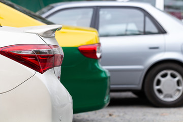 Car parked neatly inside an outdoor parking lot.