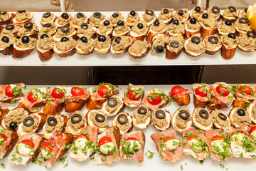 Bruschetta with Aubergine pate, cream cheese and prosciutto - baguette slices