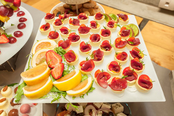 Prosciutto and rosemary with melted cheddar cheese Canape