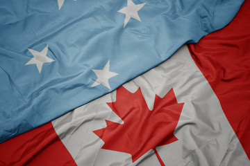 waving colorful flag of canada and national flag of Federated States of Micronesia.