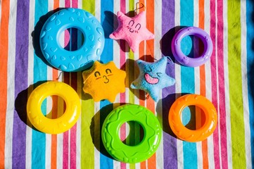 Handmade toys and plastic toys on colorful background 