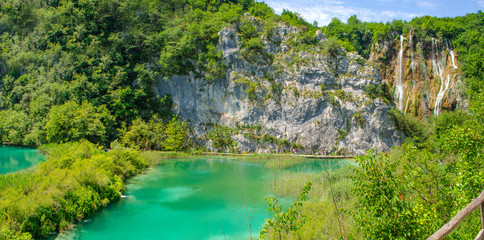 Naklejka na ściany i meble Luxurious and tumultuous waterfalls of Plitvice Lakes, Croatia