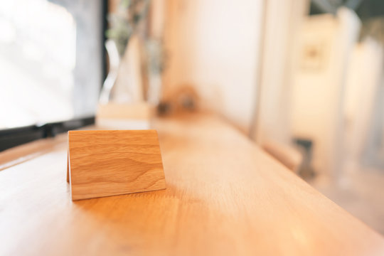 Wooden Tag Stand Label On Wood Table.