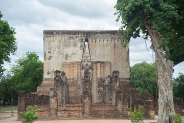 Ancient Buddha stand at Wat sri chum , Sukhothai Historical Park ,Sukhothai ,Thailand
