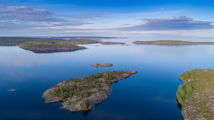 Obraz premium Russia. Karelia. Islands in lake Ladoga. The Landscape Of Russia. View of the lake from the drone. Karelian skerries. Northern nature.