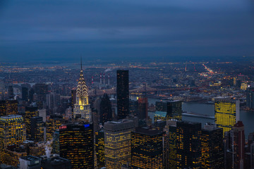 Fototapeta na wymiar View on New York City skyline at night with manhattan bridge in the back