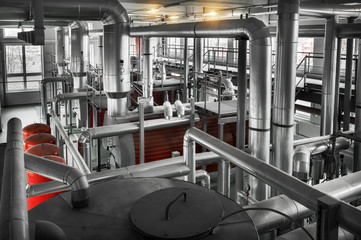 interior of boiler room with gas boilers and pipes for supplying gas and steam.  View from above