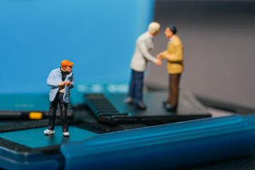 Miniature people, thief  stealing information from sd cards.
