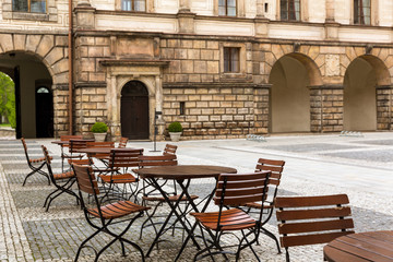 Fototapeta na wymiar Ancient stone castle with coffee tables, Europe