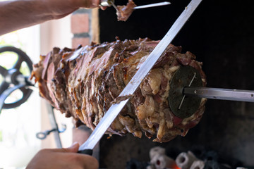 Chef prepares a traditional Turkish cag kebab at an open restaurant in Istanbul.Cag kebab is looks...