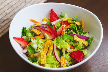 Fresh Summer Salad with Strawberries in a Wide Bowl Cenital