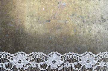 White lace on grunge background with copy space