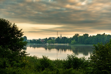 Beautiful sunset on the forest lake.