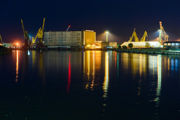 Fototapeta na wymiar Shipping cargo to harbor by crane. Water transport International.
