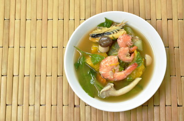boiled spicy mixed vegetable with shrimp and smoked dry fish soup on bowl