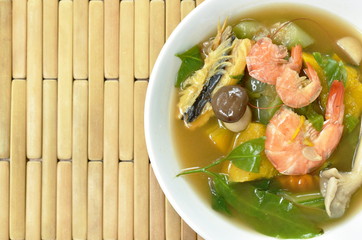 boiled spicy mixed vegetable with shrimp and smoked dry fish soup on bowl