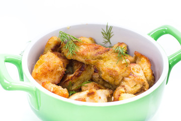 chicken fried in batter with dill on a plate