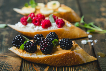 Healthy sandwich with berries and fresh baguette