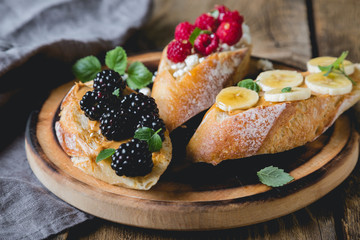 Healthy sandwich with berries and fresh baguette