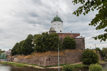 Fototapeta na wymiar Vyborg, Russia - Vyborg castle on an island in the Gulf of Finland. The famous view of Vyborg. Tower of St. Olav.