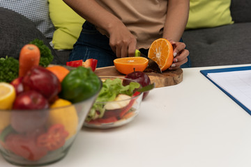 Modern woman love and take care health,learn to mix vegetable salad at home.