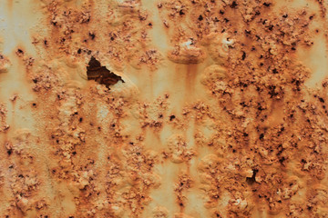 Rust stains on a gray painted iron surface