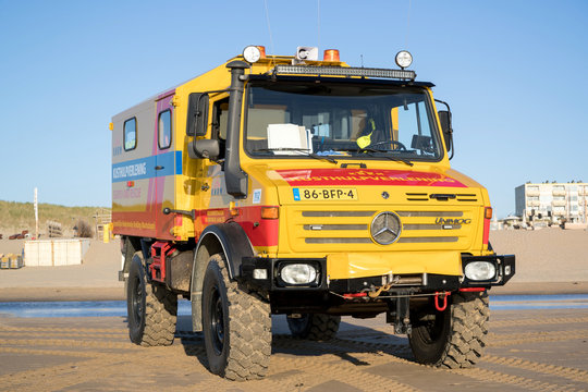 NOORDWIJK AAN ZEE, THE NETHERLANDS - JULY 1, 2019: KNRM Mercedes-Benz Unimog on the beach. KNRM is the voluntary organization in the Netherlands tasked with saving lives at sea.