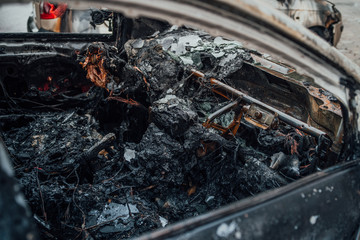 Vandalism or revenge, burnt car. The consequences of popular protest, burnt car, a crime. Car after fire. Auto trash