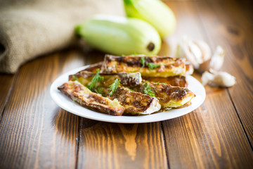 oven-baked zucchini in batter with garlic and herbs