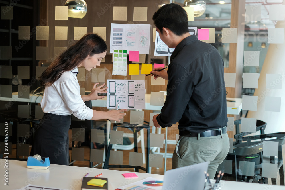 Poster designer team creative idea website designer draw outline and develop applications on smartphone.