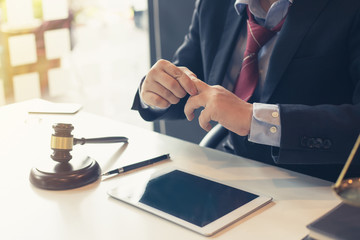 Lawyer man finger pain sitting at office.