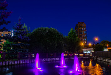 Bright fountain in the night square, Moscow