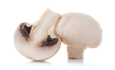mashrooms whole and sliced champignons isolated on white background