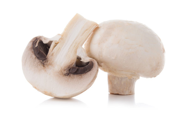mashrooms whole and sliced champignons isolated on white background
