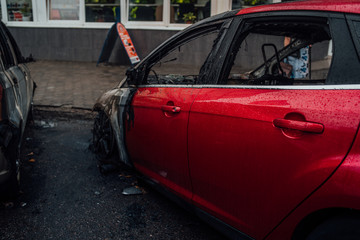 Vandalism or revenge, burnt car. The consequences of popular protest, burnt car, a crime. Car after fire. Auto trash