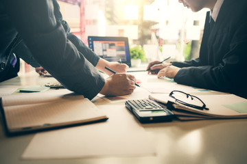 Business people meeting explaining the financial graph data and marketing plan.