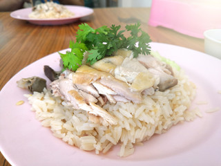 Hainanese chicken rice topping with coriander